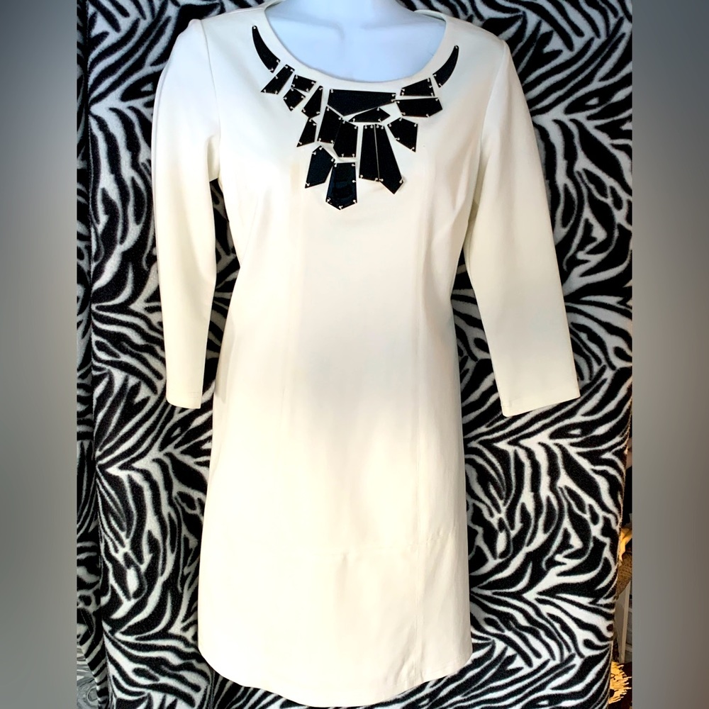Black and white Vince Camuto party dress with black metal disc design
